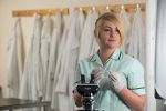 vet nurse with microscope - veterinary nursing revision courses