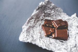 Squares of chocolate on silver foil